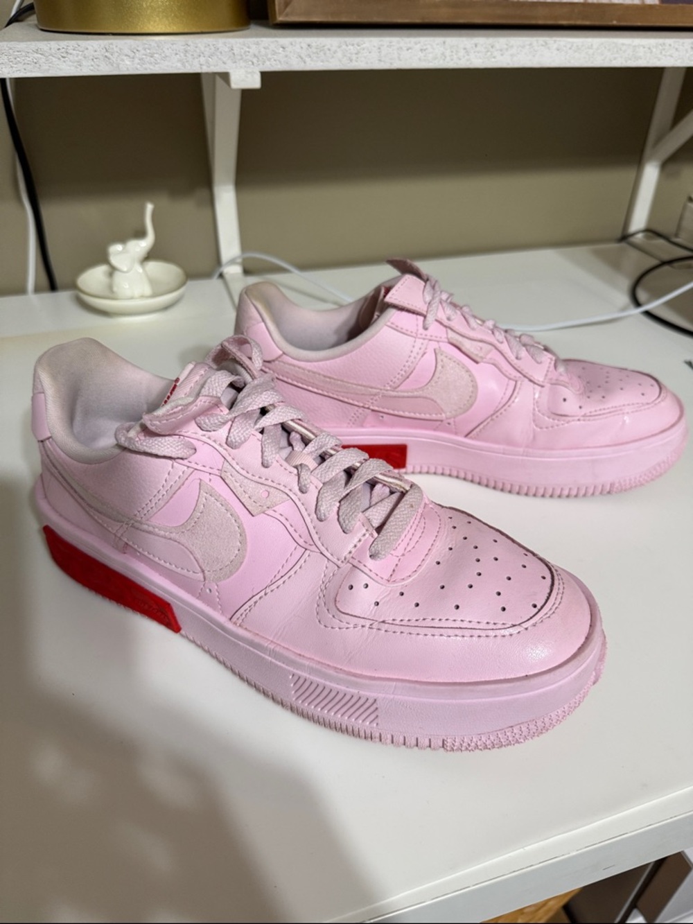 Nike Women’s Pink Low-Top Sneakers with Red Accent